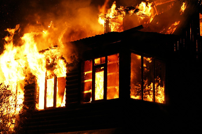 Photo of entire house engulfed in huge flames